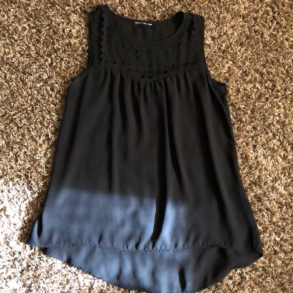 Black flowing tank top with pattern on top.